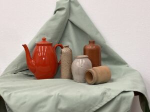 still life of pots and jars as the basis for a painting or drawing